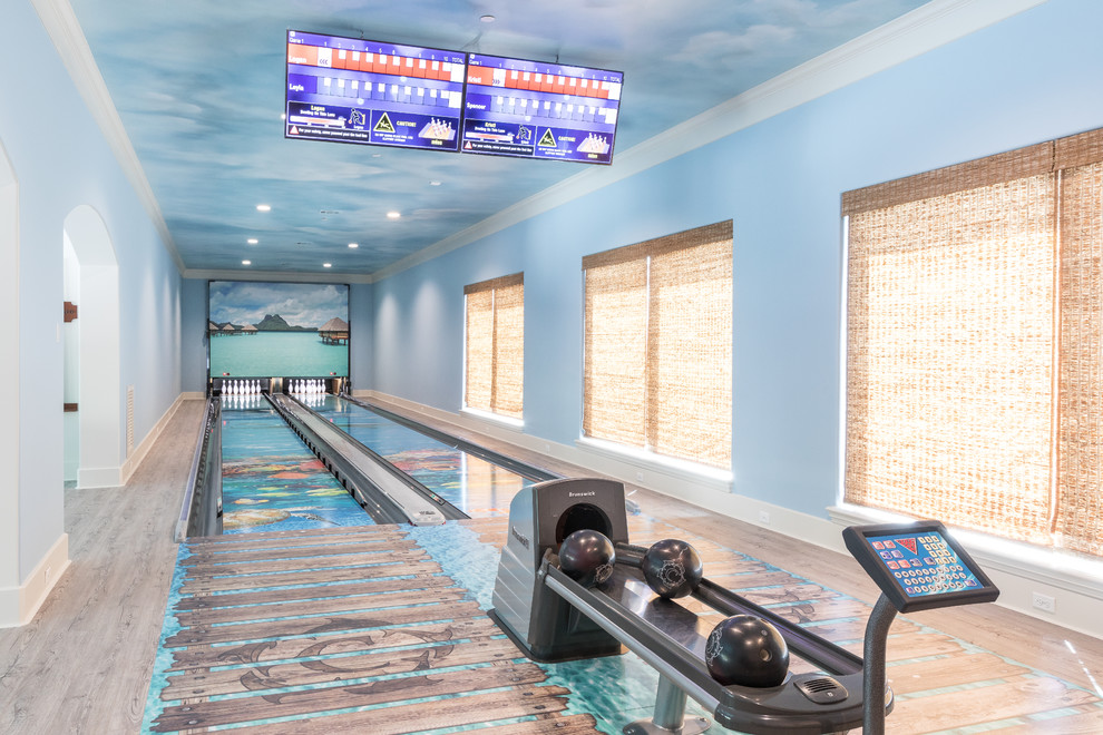 Example of a large beach style multicolored floor home gym design in Houston with blue walls