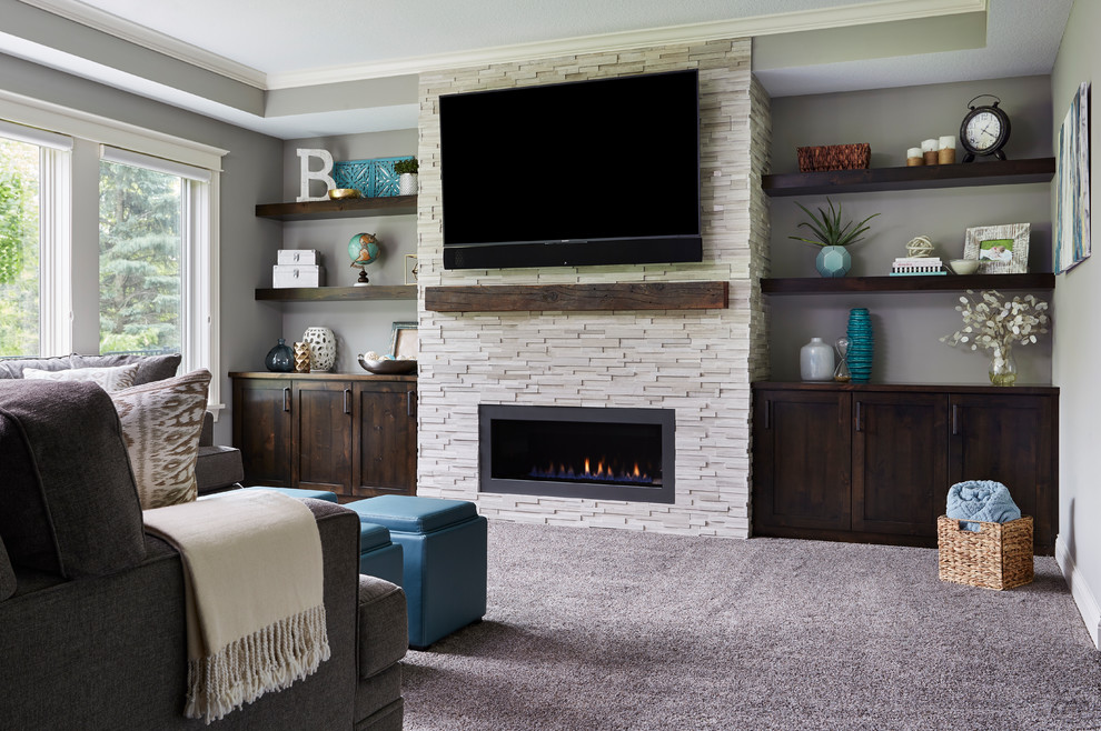 Photo of a medium sized classic walk-out basement in Minneapolis with grey walls, dark hardwood flooring, a standard fireplace, a tiled fireplace surround and brown floors.