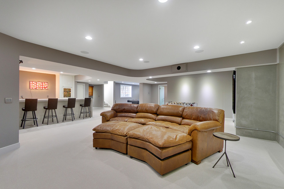 Example of a mid-sized trendy underground carpeted basement design in Minneapolis with gray walls and no fireplace