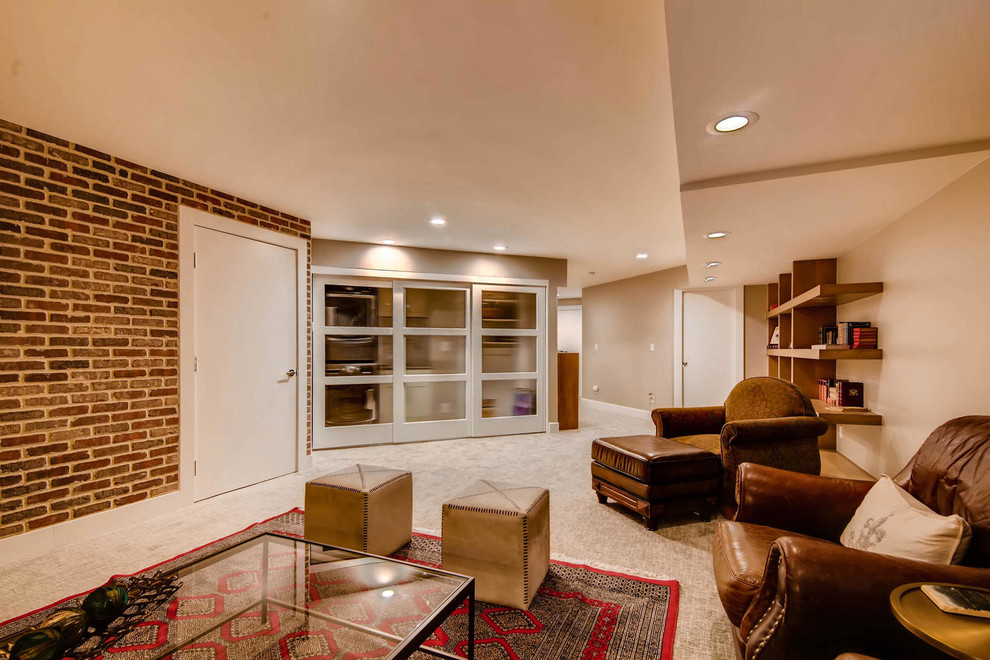 Huge eclectic underground carpeted and beige floor basement photo in Denver with red walls