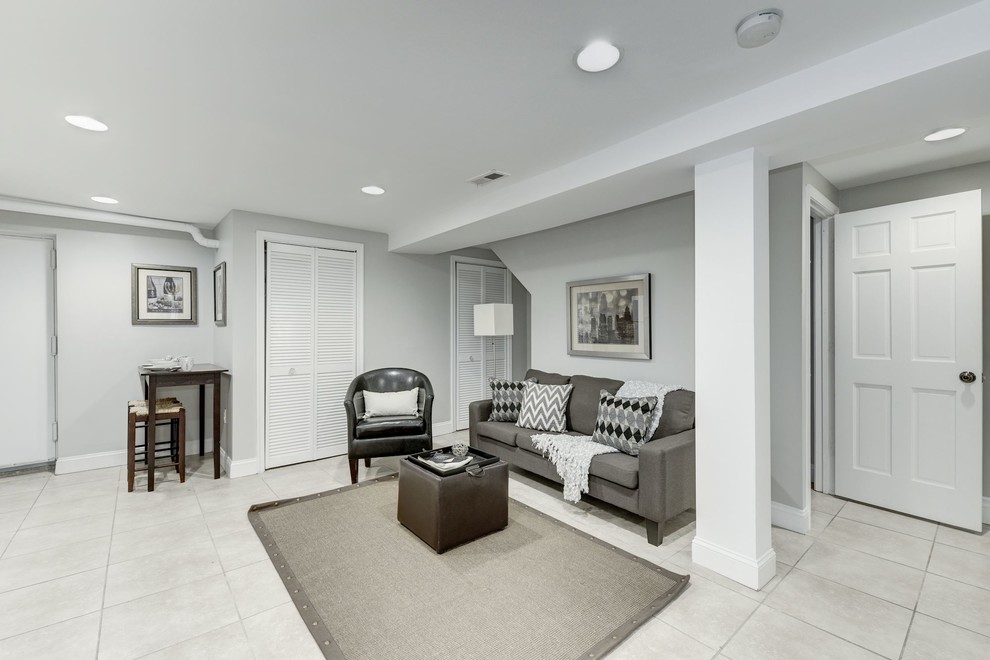 Photo of a large traditional look-out basement in DC Metro with grey walls, ceramic flooring, grey floors and no fireplace.