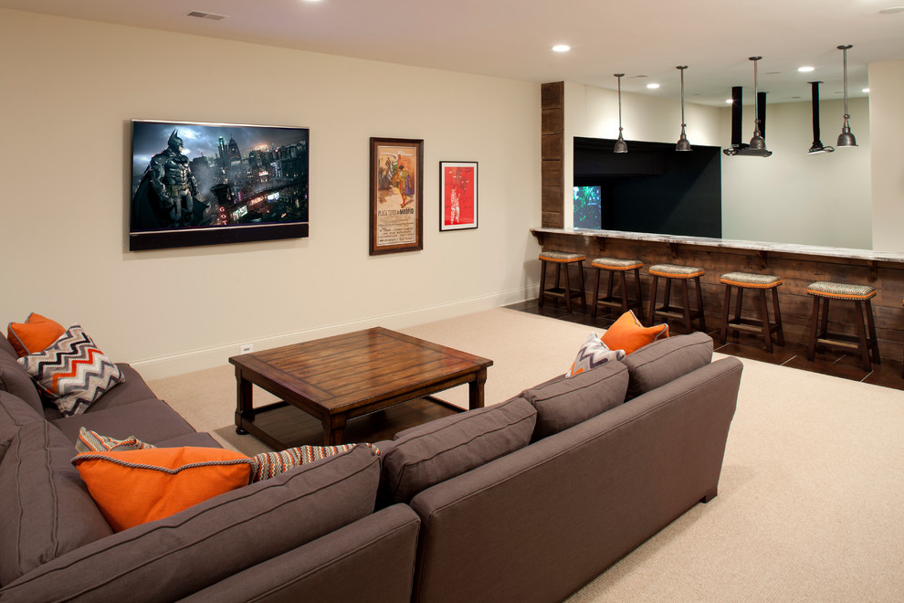 This is an example of an expansive classic fully buried basement in Minneapolis with beige walls and carpet.