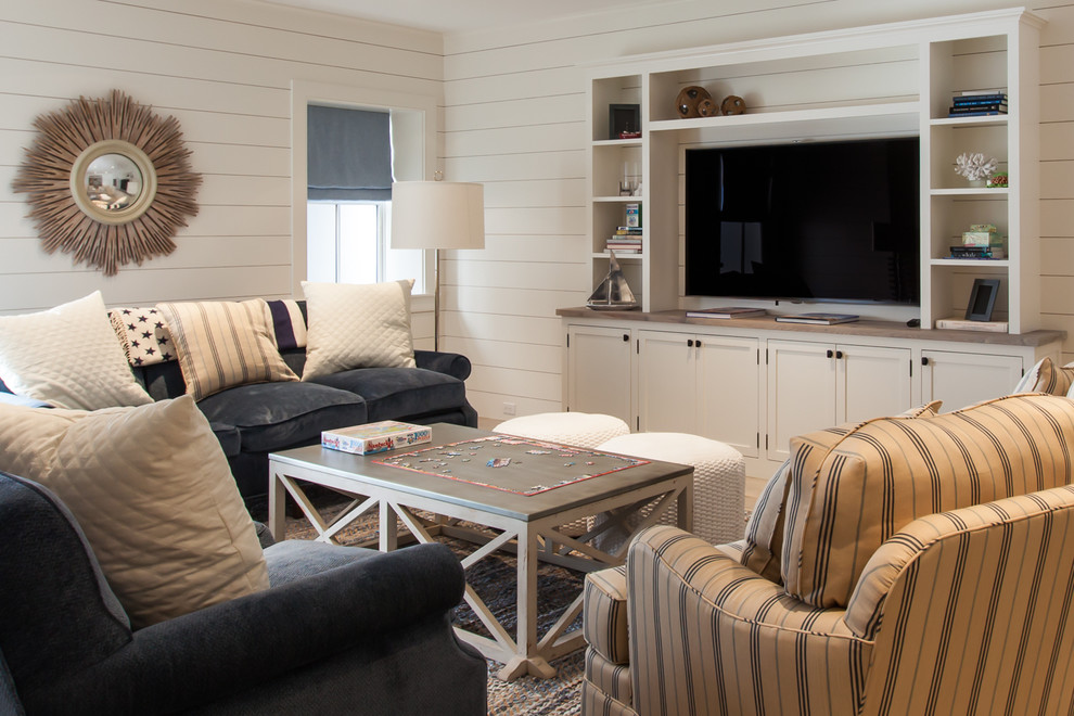 Example of a mid-sized beach style look-out basement design in Boston with white walls and no fireplace