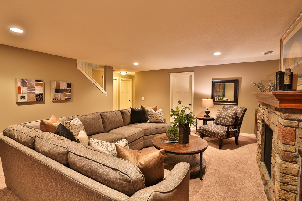 Example of a mid-sized underground carpeted basement design in Minneapolis with beige walls, a standard fireplace and a stone fireplace