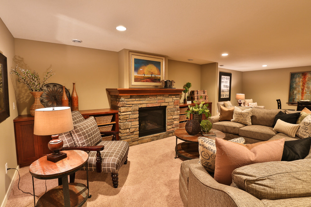 Basement - mid-sized underground carpeted basement idea in Minneapolis with beige walls, a standard fireplace and a stone fireplace