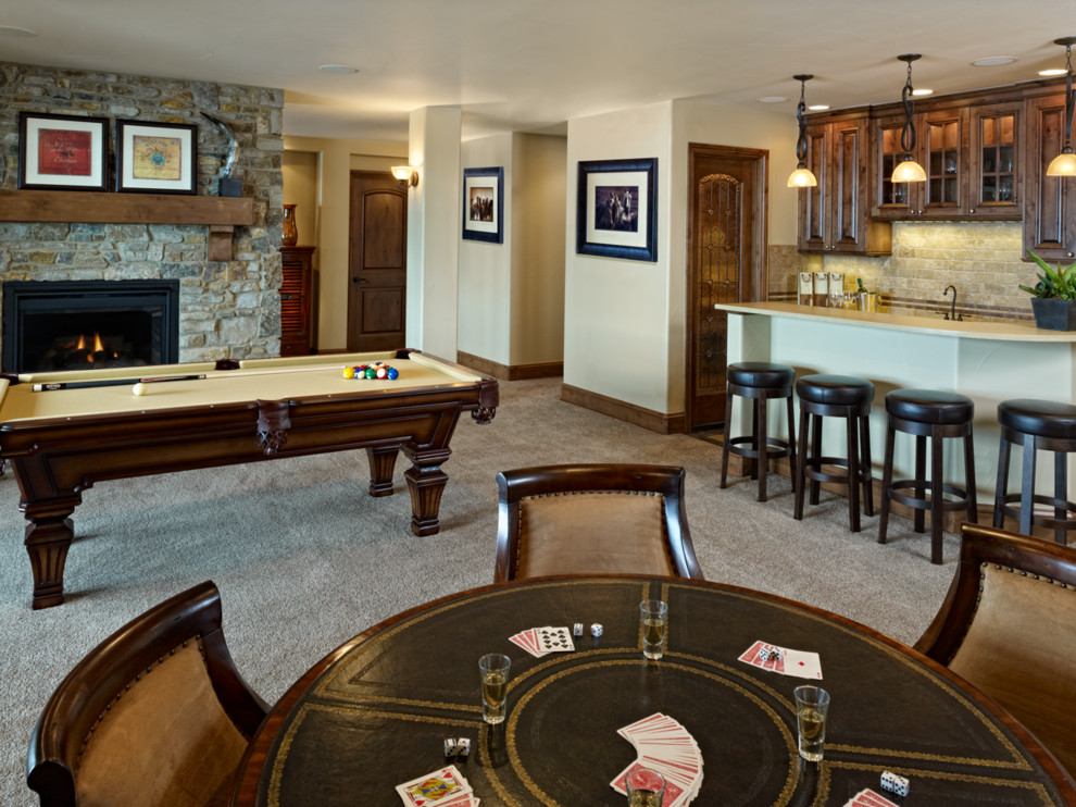 Large elegant walk-out carpeted basement photo in Denver with beige walls, a standard fireplace and a stone fireplace