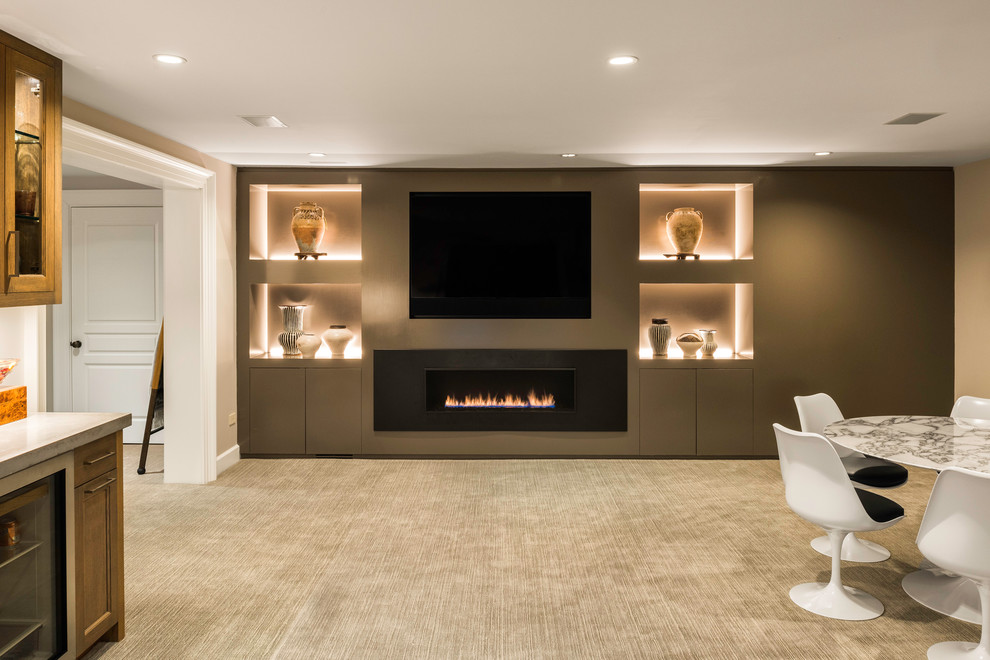 Design ideas for a contemporary fully buried basement in New York with beige walls, carpet, a ribbon fireplace and beige floors.
