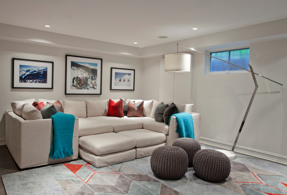 This is an example of a contemporary look-out basement in Chicago with white walls and no fireplace.