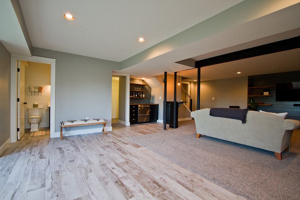 Example of a large arts and crafts underground carpeted and beige floor basement design in Other with beige walls and no fireplace