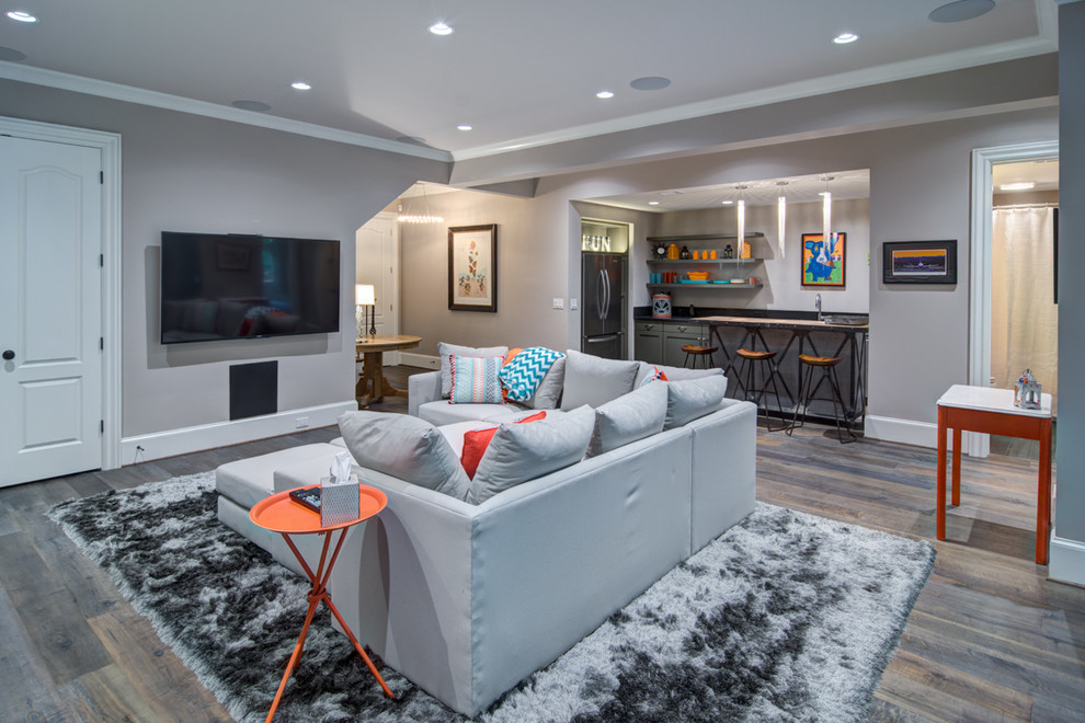 Inspiration for a large modern walk-out medium tone wood floor basement remodel in Atlanta with gray walls, a ribbon fireplace and a tile fireplace