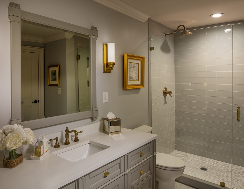 Photo of a large traditional shower room bathroom in Atlanta with grey walls, ceramic flooring, white floors, grey cabinets, a double shower, grey tiles, metro tiles, a submerged sink, engineered stone worktops, a hinged door, white worktops, a single sink and a freestanding vanity unit.