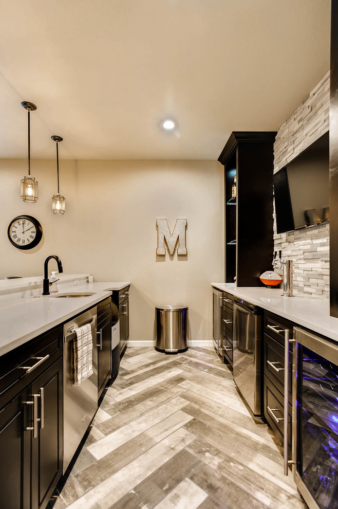 This is an example of a medium sized contemporary fully buried basement in Denver with ceramic flooring, grey floors, beige walls and no fireplace.