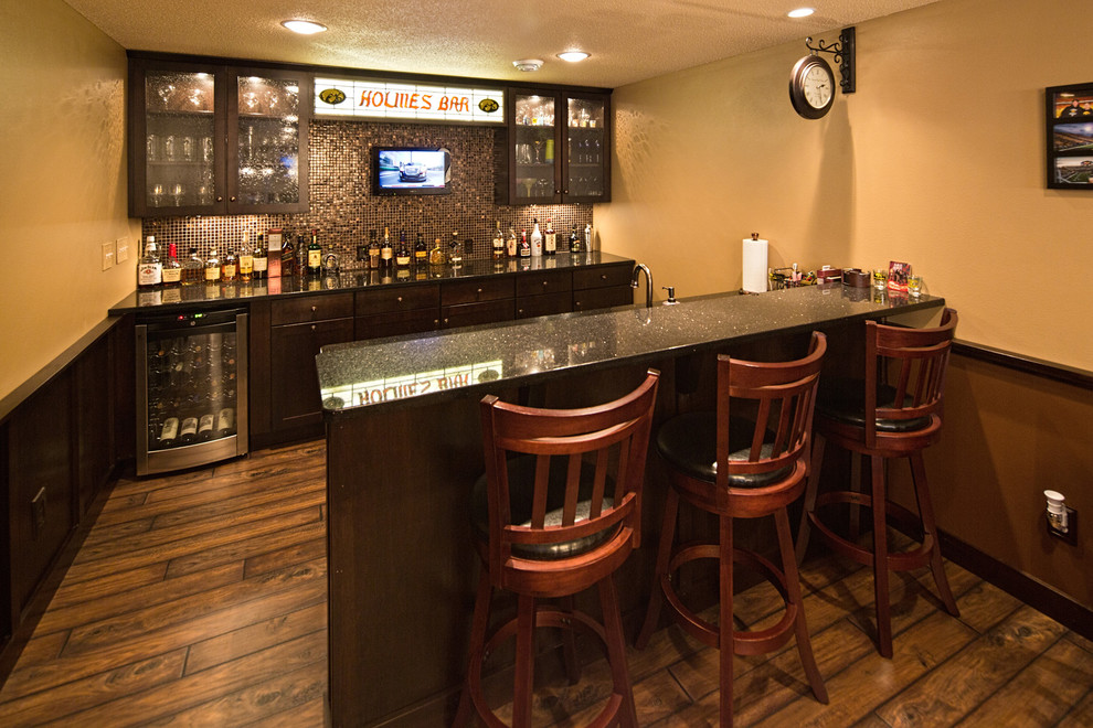 This is an example of a traditional home bar in Other.