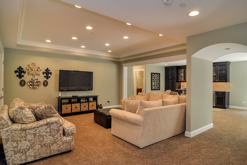 Basement - large traditional walk-out carpeted basement idea in Nashville with green walls