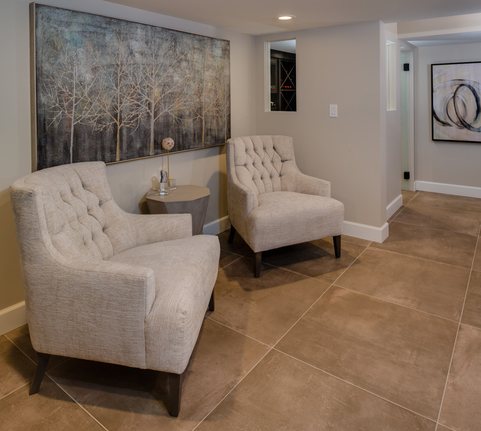 Mid-sized trendy look-out porcelain tile and beige floor basement photo in Detroit with beige walls, a ribbon fireplace and a stone fireplace