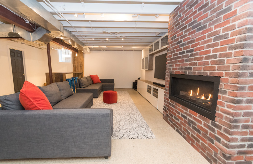 Basement - large industrial underground concrete floor basement idea in Toronto with white walls, a standard fireplace and a brick fireplace