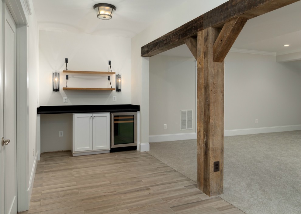 Example of a large cottage porcelain tile and brown floor basement design in DC Metro with beige walls and no fireplace