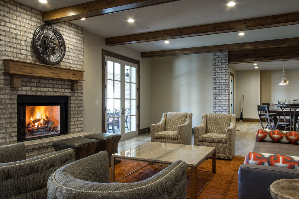 Example of a huge classic look-out medium tone wood floor and brown floor basement design in Salt Lake City with gray walls, a standard fireplace and a brick fireplace