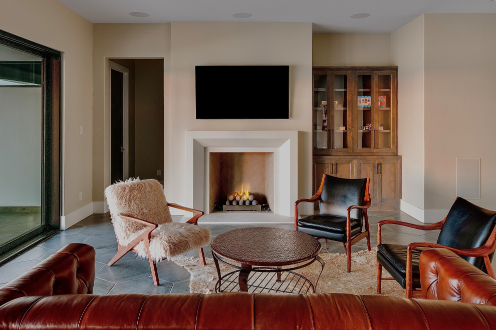 Tuscan basement photo in Dallas with a concrete fireplace