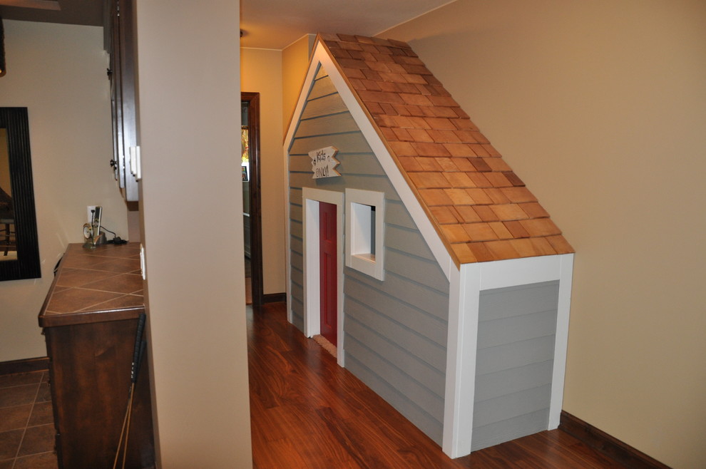 Inspiration for a small timeless walk-out medium tone wood floor basement remodel in Minneapolis with beige walls