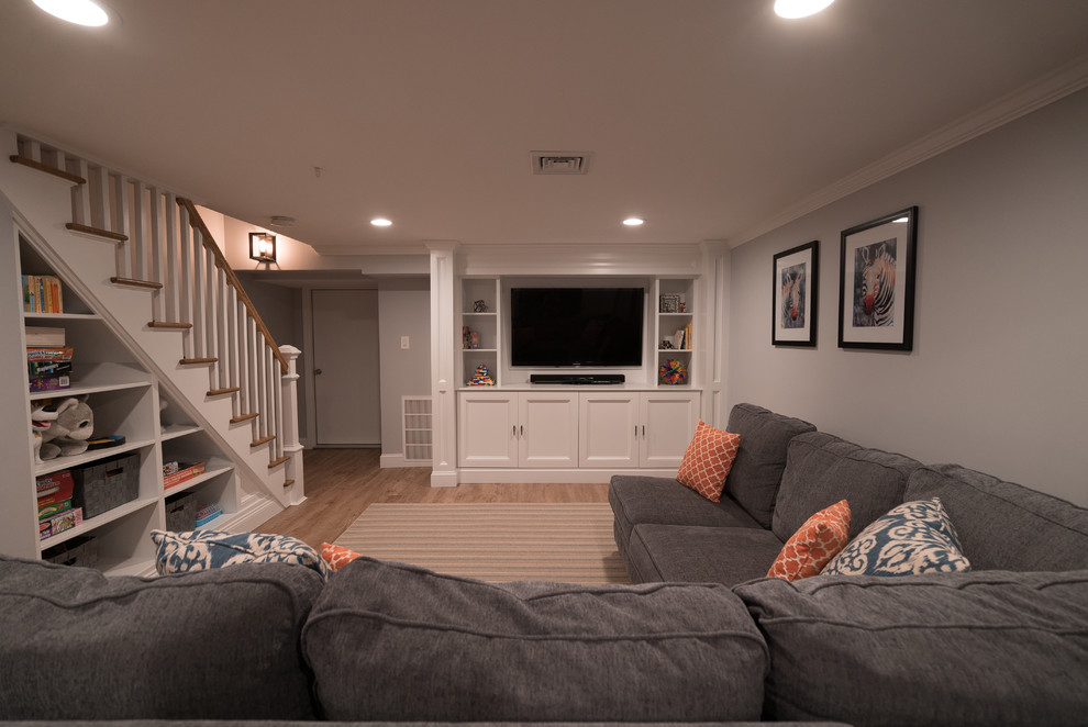 Basement - mid-sized transitional look-out basement idea in New York with gray walls