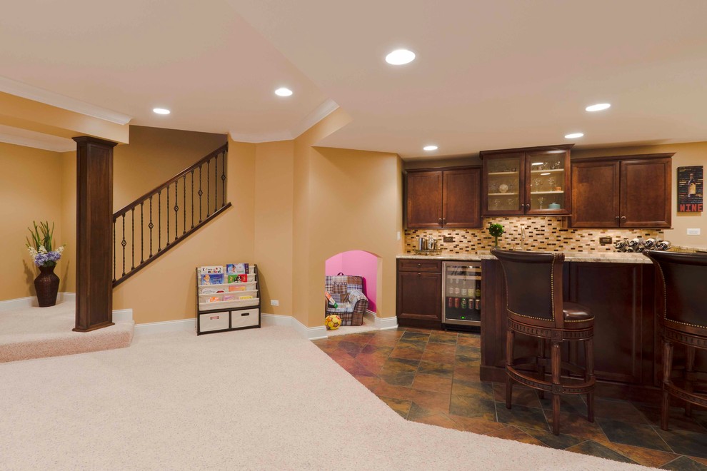 Photo of a large contemporary fully buried basement in Chicago with orange walls and carpet.