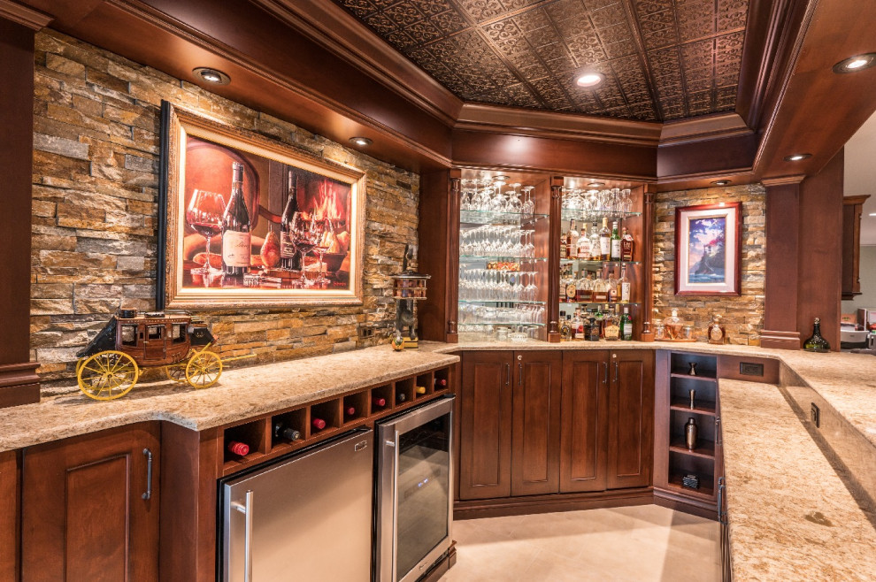 Example of a mid-sized classic basement design in DC Metro with a bar