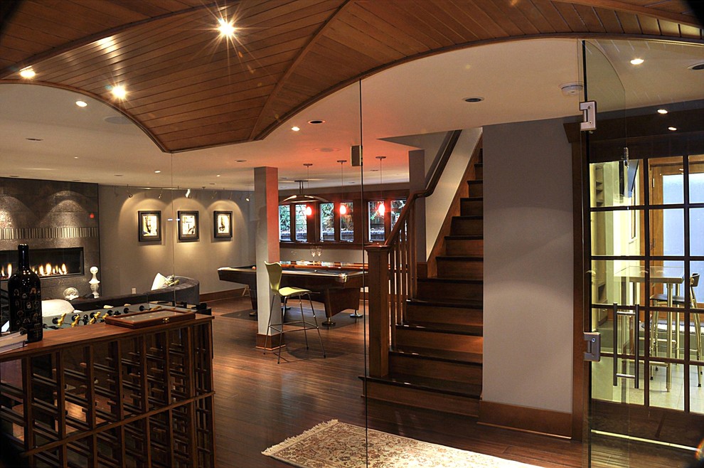 Example of a trendy look-out bamboo floor basement design in Seattle with gray walls
