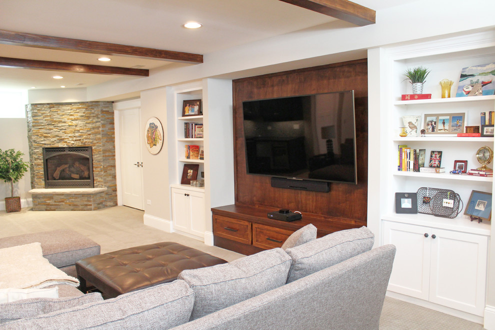 Inspiration for a large timeless look-out carpeted and beige floor basement remodel in Chicago with gray walls, a corner fireplace and a stone fireplace