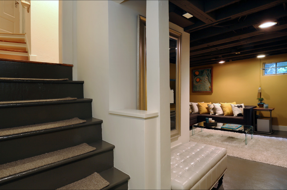 Example of a small trendy look-out concrete floor basement design in Portland with yellow walls and no fireplace