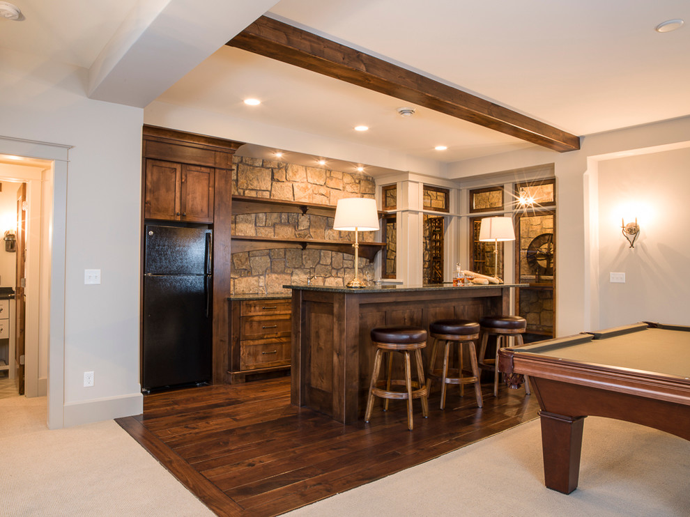 Inspiration for a large rustic walk-out medium tone wood floor basement remodel in Minneapolis with gray walls