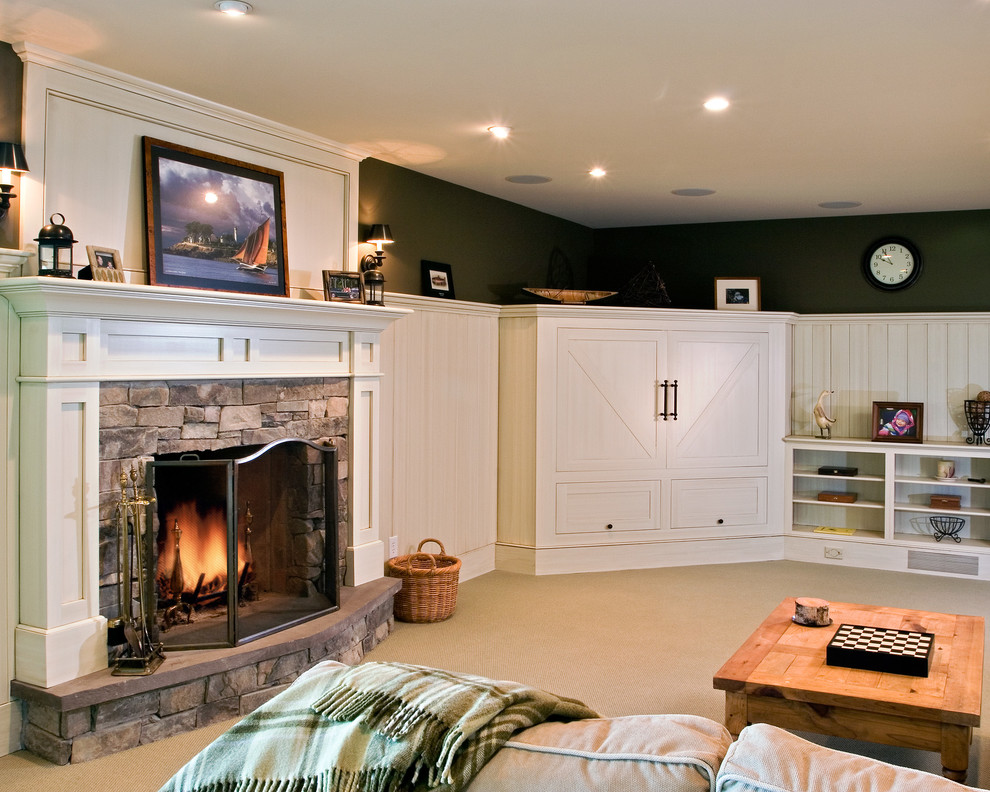Mid-sized elegant walk-out carpeted basement photo in Boston with green walls, a standard fireplace and a stone fireplace
