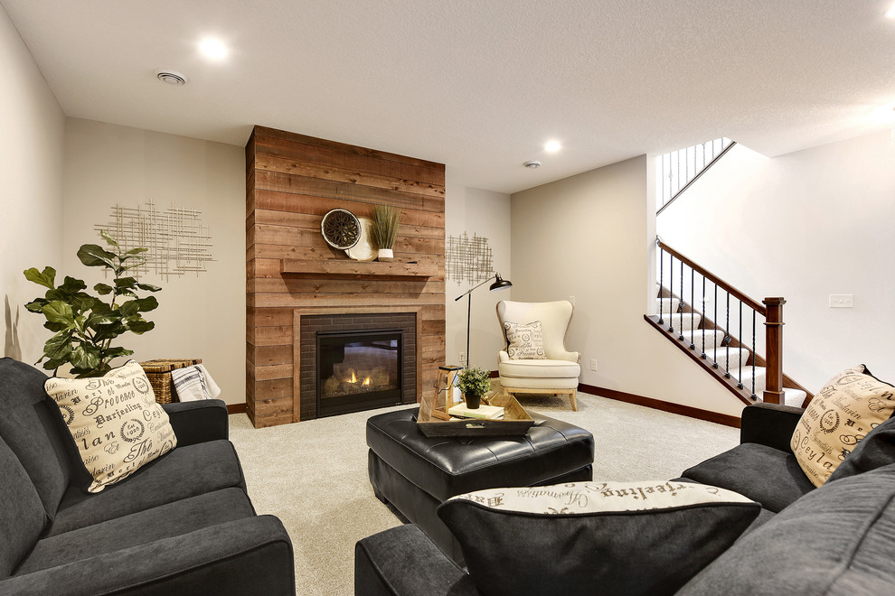 Photo of a large traditional look-out basement in Minneapolis with grey walls, carpet, a standard fireplace, a brick fireplace surround and white floors.
