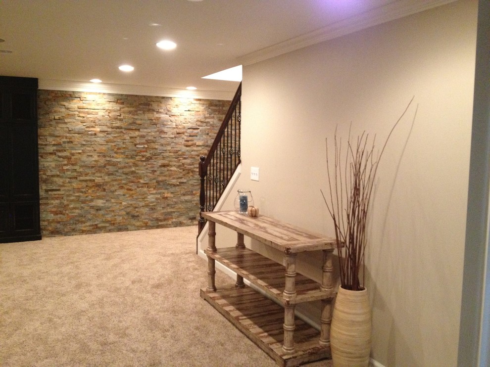 This is an example of a modern basement in Detroit with carpet and beige walls.