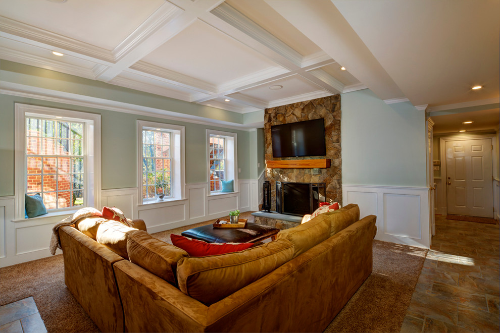Inspiration for a mid-sized timeless look-out carpeted basement remodel in Richmond with green walls, a standard fireplace and a stone fireplace