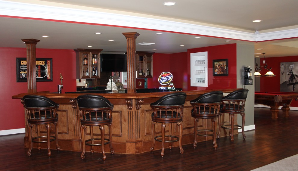 Example of a huge classic walk-out vinyl floor and brown floor basement design in Baltimore with red walls and no fireplace