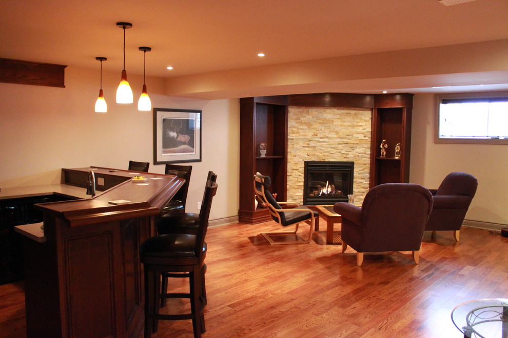 Design ideas for a traditional basement in Ottawa with a corner fireplace.