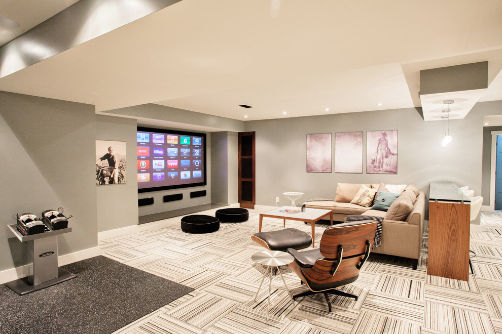 Example of a trendy underground carpeted and multicolored floor basement design in Toronto with gray walls, no fireplace and a home theater