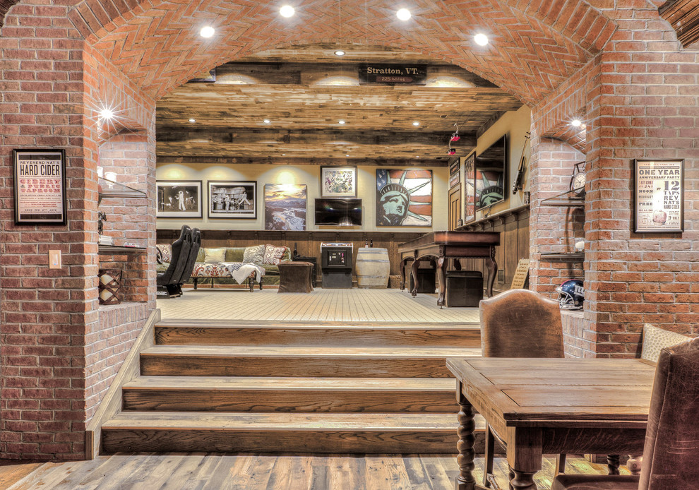 Example of a large mountain style look-out dark wood floor basement design in New York with beige walls and no fireplace