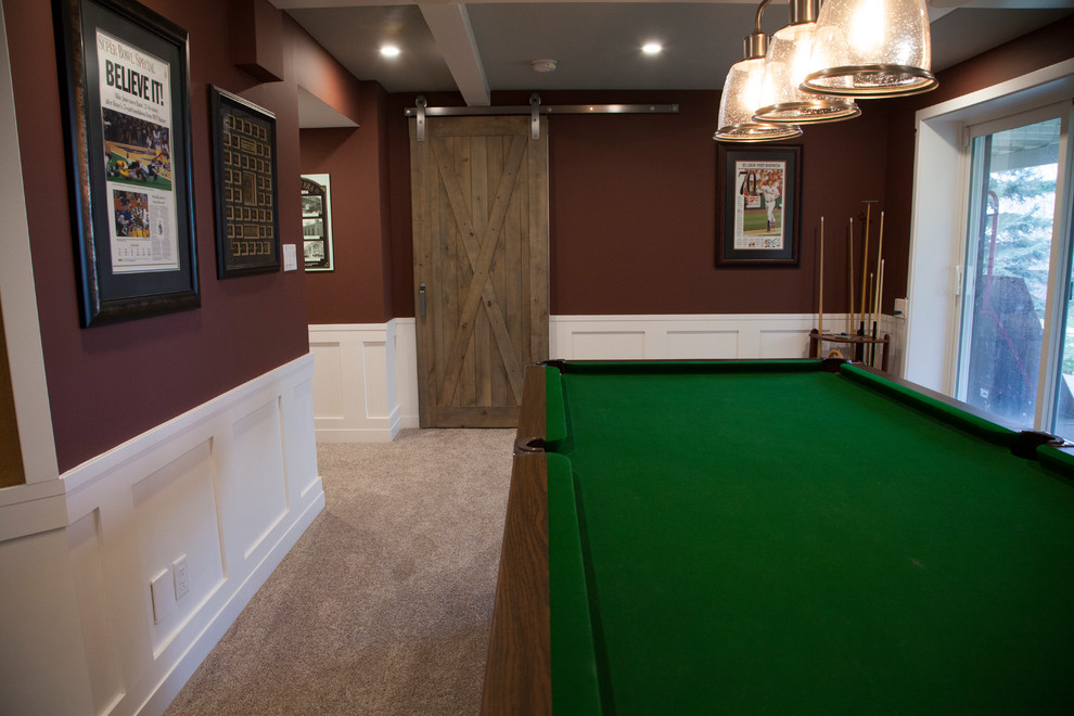 Inspiration for a large farmhouse games room in Edmonton with red walls, carpet and beige floors.