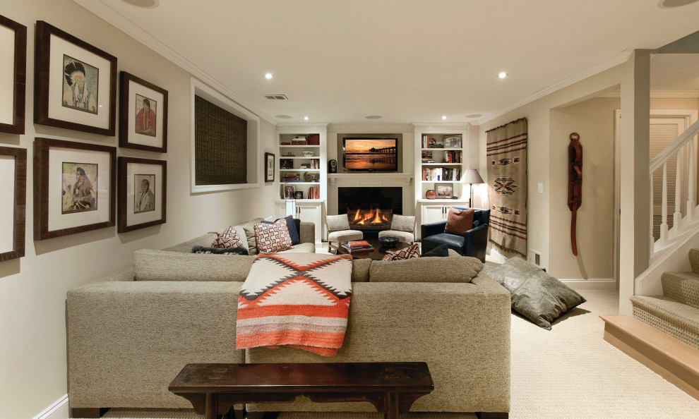 Basement - southwestern underground carpeted and beige floor basement idea in DC Metro with beige walls, a standard fireplace and a wood fireplace surround
