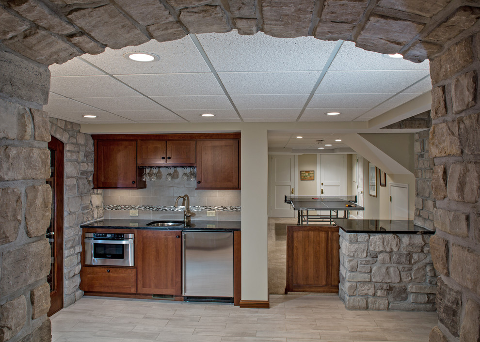 This is an example of a large contemporary basement in St Louis with beige walls and ceramic flooring.
