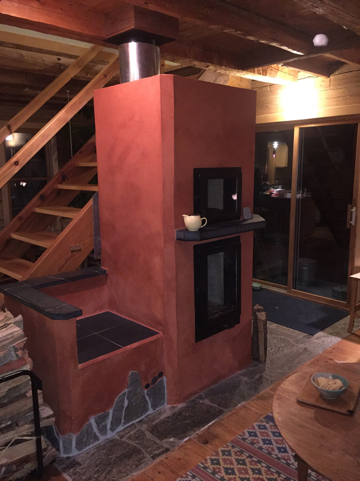 Basement in San Diego with a wood burning stove.
