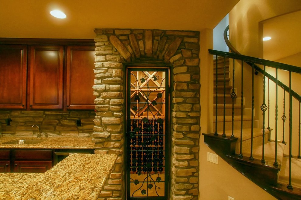 Inspiration for a mid-sized eclectic carpeted wine cellar remodel in Denver