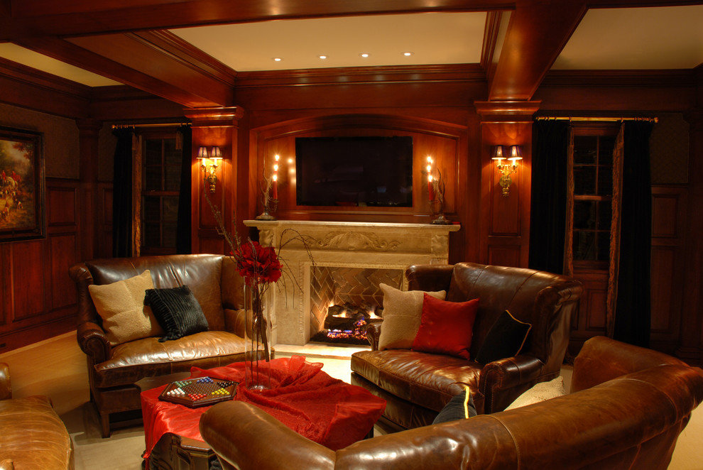 This is an example of a traditional look-out basement in Kansas City with brown walls, carpet and a standard fireplace.