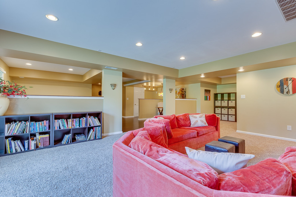 Design ideas for a large traditional look-out basement in Louisville with beige walls and carpet.