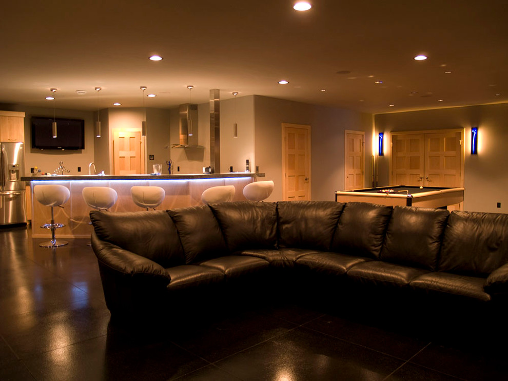 Design ideas for a modern basement in Other with beige walls and black floors.