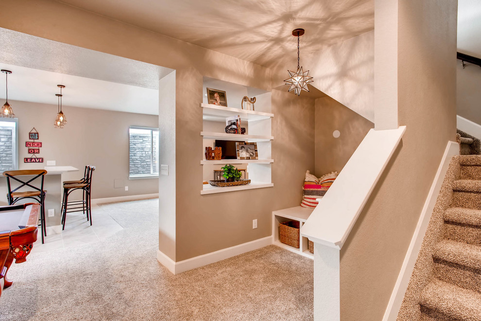 Example of a large mountain style underground carpeted and beige floor basement design in Denver with beige walls and no fireplace