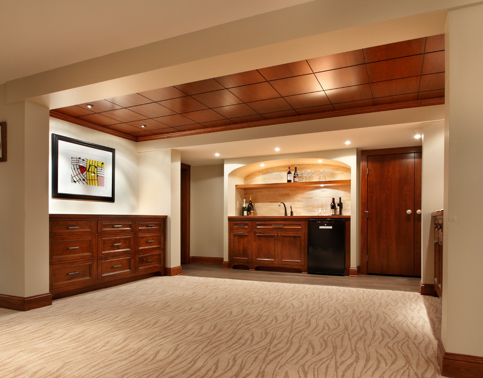 Example of a trendy underground carpeted basement design in Minneapolis with beige walls