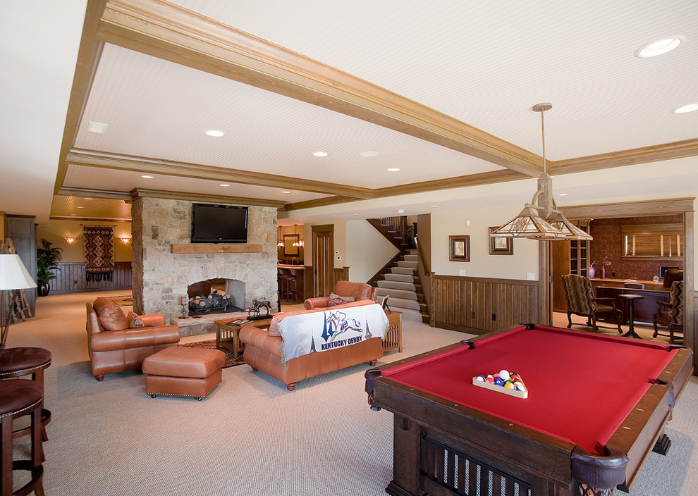 Example of a large farmhouse walk-out carpeted basement design in Chicago with a standard fireplace and a stone fireplace